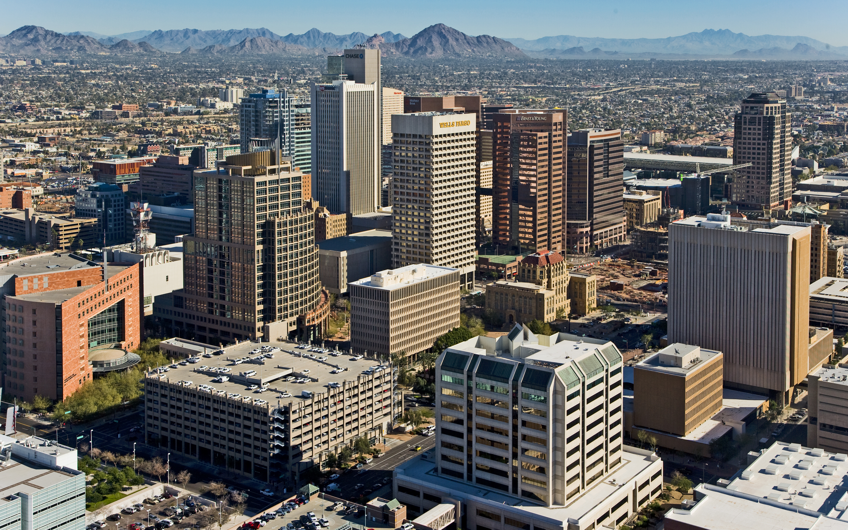 Downtown Phoenix skyline and desert mountains in daylight